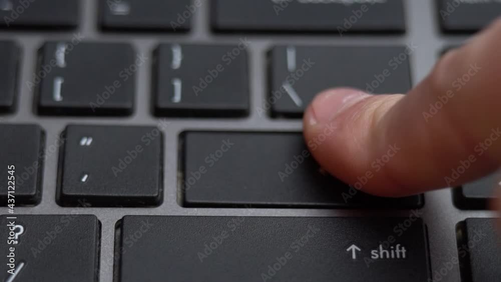 Enter button pressing a lot of times on keyboard, laptop keyboard close up