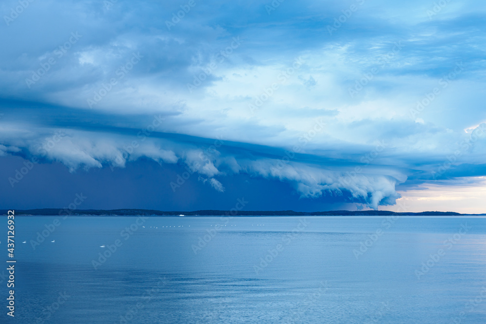 View of dramatic rain clouds over the coast, in Nynäshamn, Sweden