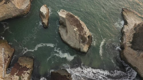 Aerial view of the ocean at Shark Fin Cove on Highway 1 in Northern California. Drone video filming, beautiful sandy beach. photo