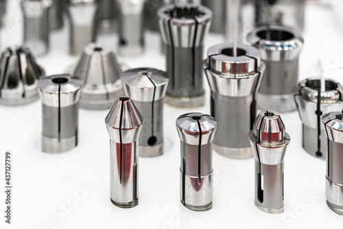 Various many type and size spring steel collet chuck for cnc machining center or automatic milling machine on table photo