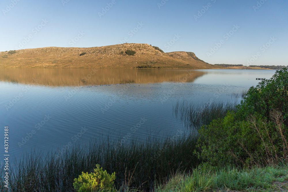 Small lagoon at the foot of the mountain ranges in the countryside of Argentina