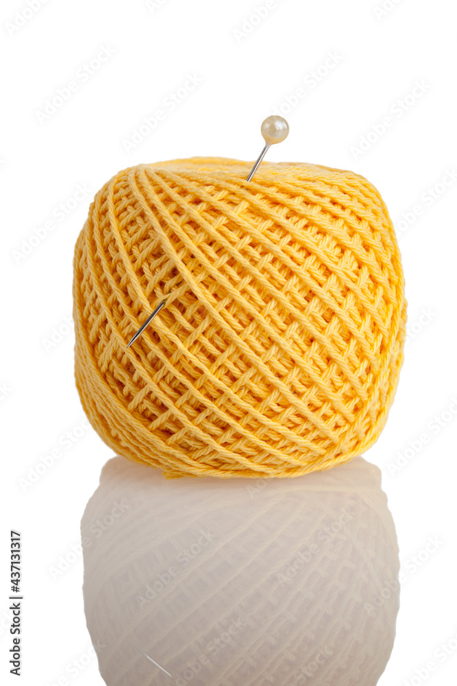 spool, bobbin with thread for sewing yellow with a needle, isolated on a white background, the concept of sewing embroidery, with your own hands, tailor's craft