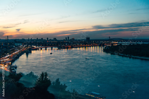 Kiev  Ukraine - May  22  2021. Evening panorama of the city overlooking the Dnieper river. Sunset.