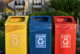 Yellow blue and red dustbins for separate waste management, circular economy concept. 
