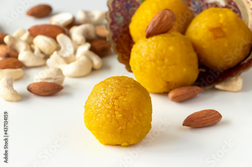 Famous authentic Indian sweets Motichoor Laddu made from besan or chickpeas flour. Vegetarian and healthy food. White background.