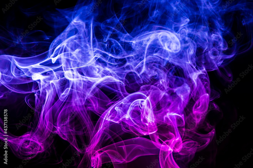 Fototapeta premium Colored smoke on black background