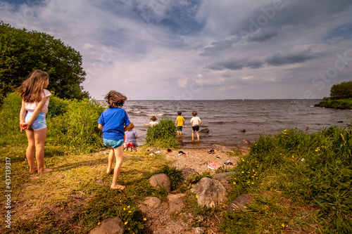 Lough Neagh in Northern Ireland summer 2021 children running into the water photo