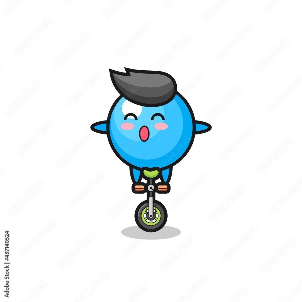 The cute bubble gum character is riding a circus bike The cute bubble gum character is riding a circus bike