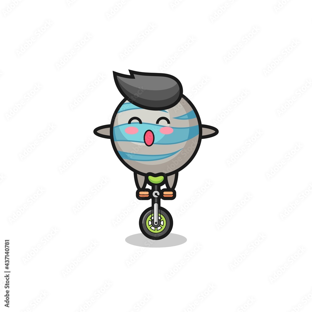 The cute planet character is riding a circus bike The cute planet character is riding a circus bike