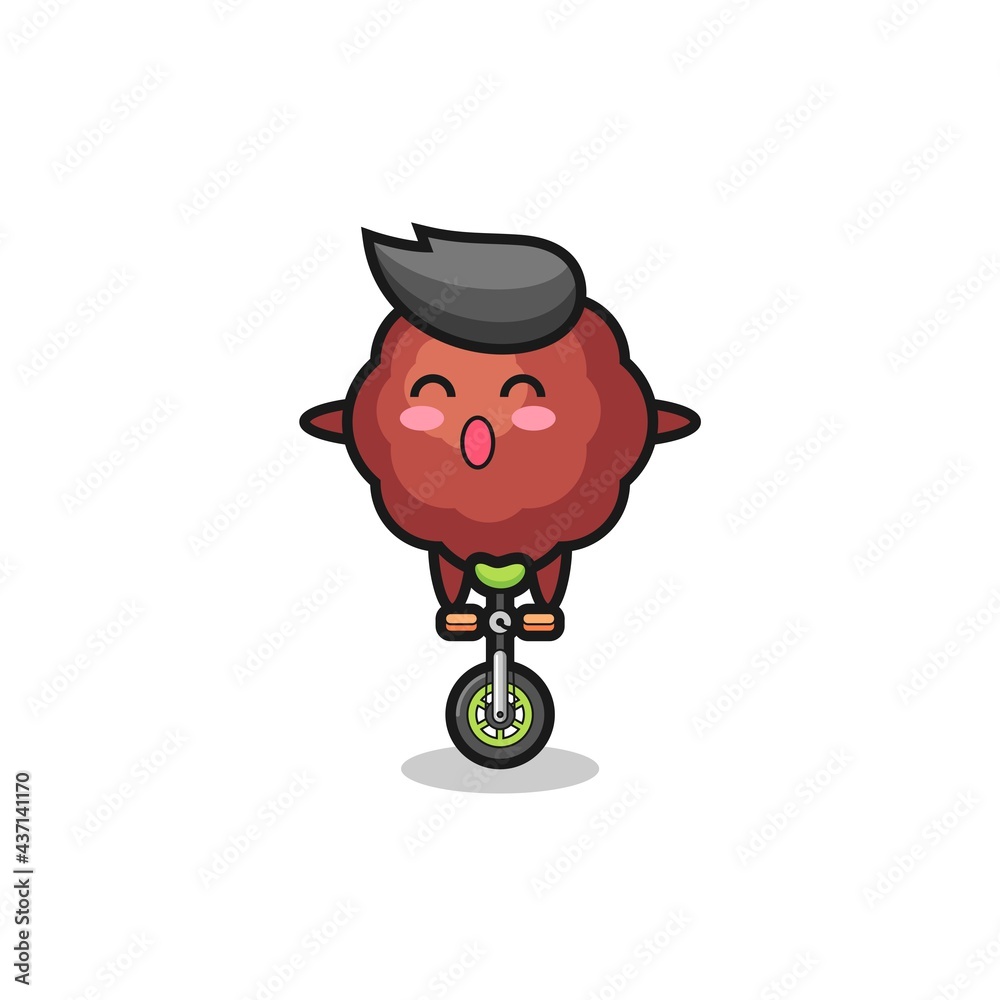 The cute meatball character is riding a circus bike