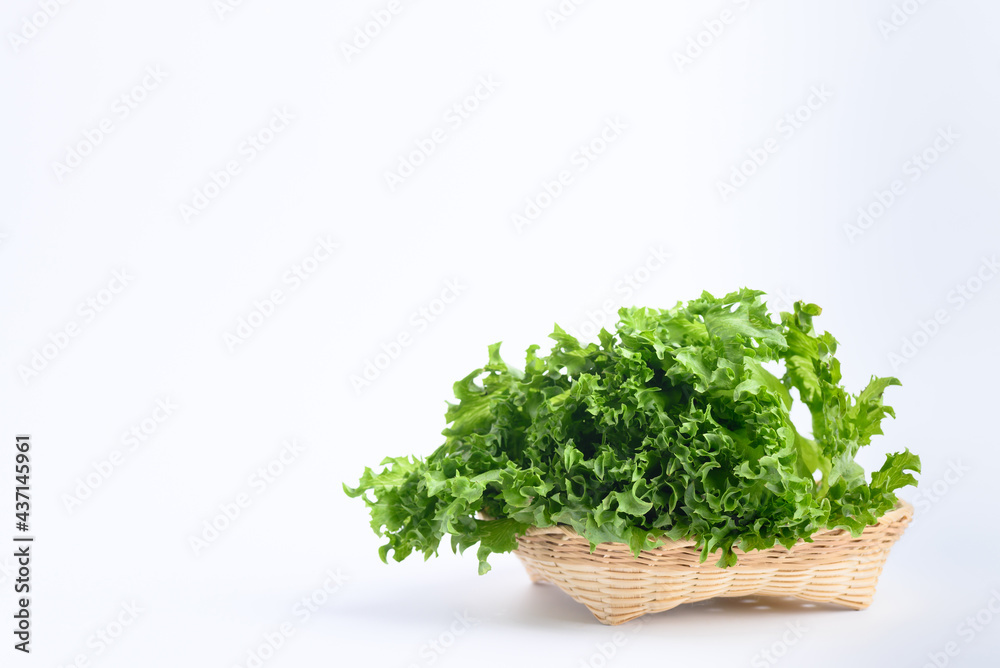 Fresh lettuce leaf in bamboo basket on white background, Green frillice iceberg lettuce Fresh lettuce leaf in bamboo basket on white background, Green frillice iceberg lettuce