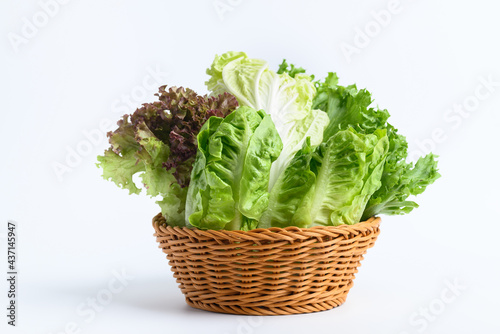 Fresh various lettuce leaf in basket on white background, Organic vegetable for salad cooking, Healthy eating, Vegan food concept