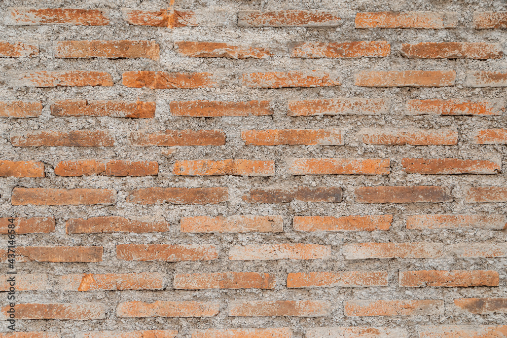 Naklejka premium Wall background, red brick with cement texture