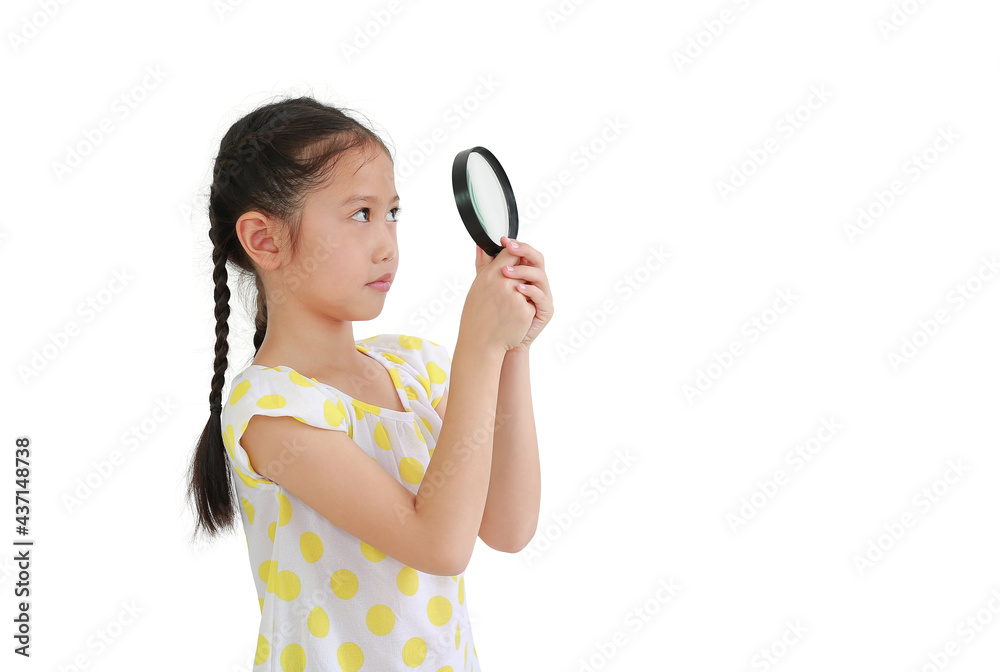 Asian little child girl looking up through a magnifying glass isolated on white background Asian little child girl looking up through a magnifying glass isolated on white background
