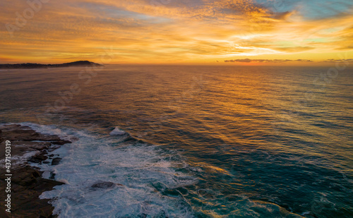 Aerial Sunrise Seascape Panorama at Rocky Inlet with colourful high cloud