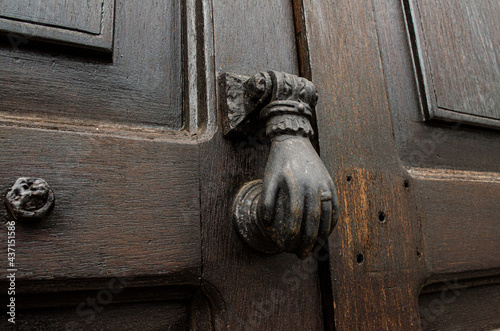 old wooden door with lock and knocker