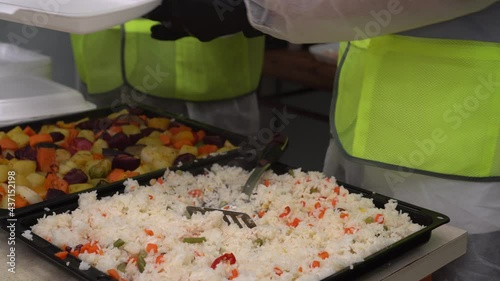 Food donation. Volunteers distribute hot food to those in need