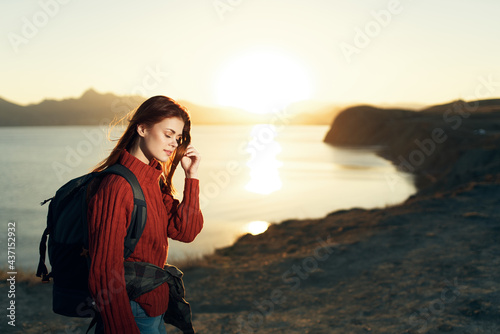 woman with backpack travel landscape in rocky mountains © SHOTPRIME STUDIO