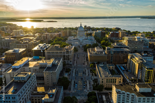 Aerial view of main street in Madison, Wisconsin. Capitol building as city dominant with sun as background photo