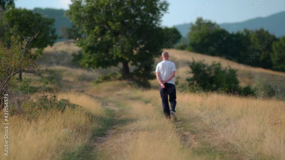 Alone elderly male tourist walking, hiking in the mountains Alone elderly male tourist walking, hiking in the mountains