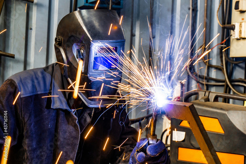 Canvas Print Welding work in an electromechanical workshop at a mechanical assembly site