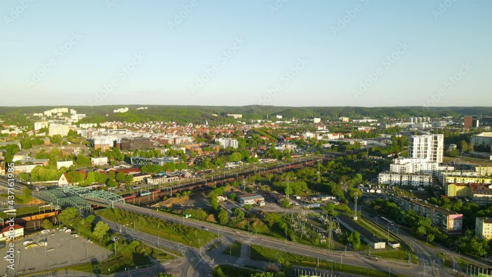 Aerial view of passing train, driving cars and beautiful cityscape of Gdansk in summer. Aerial view of passing train, driving cars and beautiful cityscape of Gdansk in summer.