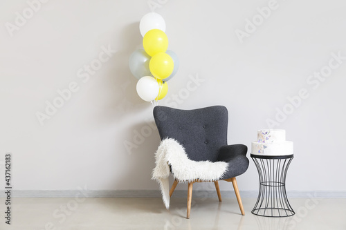 Armchair with balloons and ...