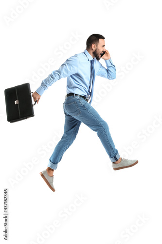 Jumping young man talking b...