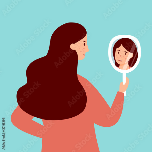 Young woman hand mirror worrying about her acne on face in flat design. Pimple problem on female skin.