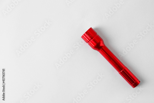 Modern flashlight on light ...