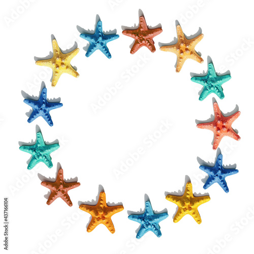 Round frame from colorful with colorful sea stars. Happy  bright and summer mood flat lay.