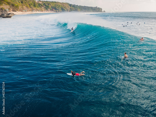 Canvas Print Aerial view with surfing on barrel wave