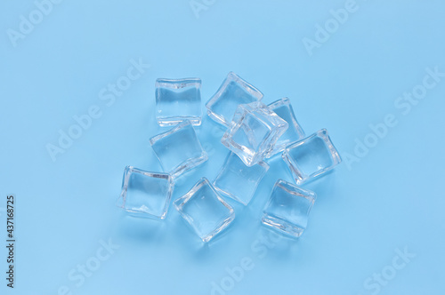 Acrylic ice cubes  Plastic ice cubes on light blue background. 
