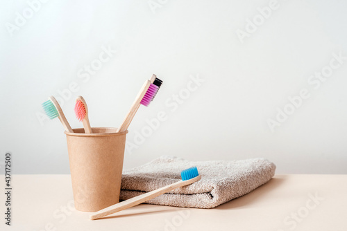 Zero waste bamboo toothbrushes in paper cup, dental care with zero waste concept, sustainable lifestyle