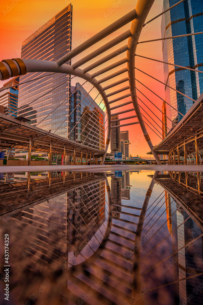 Modern structure bridge shape and building at sunset in train station, Bangkok, Thailand. Modern structure bridge shape and building at sunset in train station, Bangkok, Thailand.