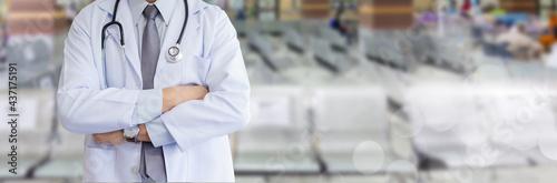 Portrait image half body, Doctor uniform stethoscope posing cross arm wiht blur background hospital. ​healthcare concept.,image panoramic banner.