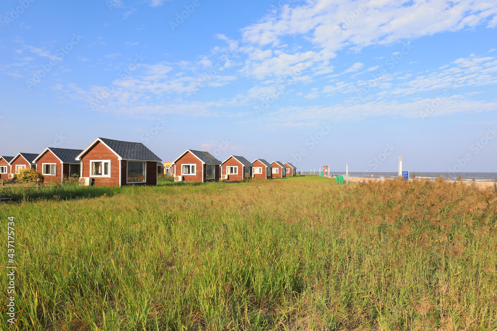 The wooden house in the background of blue sky The wooden house in the background of blue sky