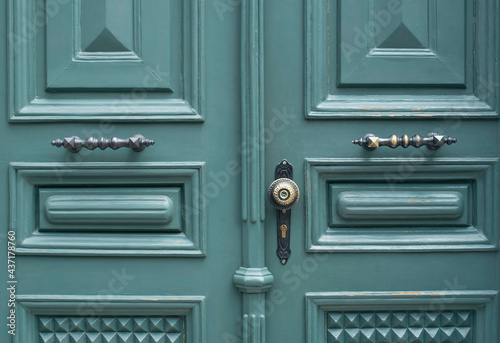 Parts of renovate wooden door - brass handles and lock close