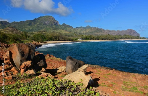 Spectacularly-eroded coastline. lava boulders, and surf at mahaulepu beach along the heritage trail in poipu, kauai, Hawaii