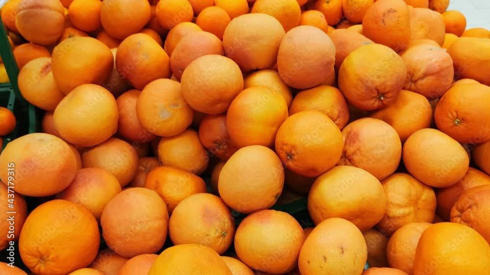 Stack of oranges in grocery store. Industry of selling products Stack of oranges in grocery store. Industry of selling products