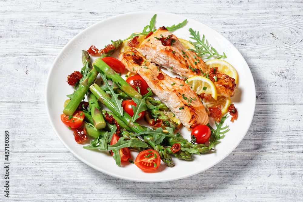 grilled salmon fillets with lemon, bacon,vegetables grilled salmon fillets with lemon, bacon,vegetables
