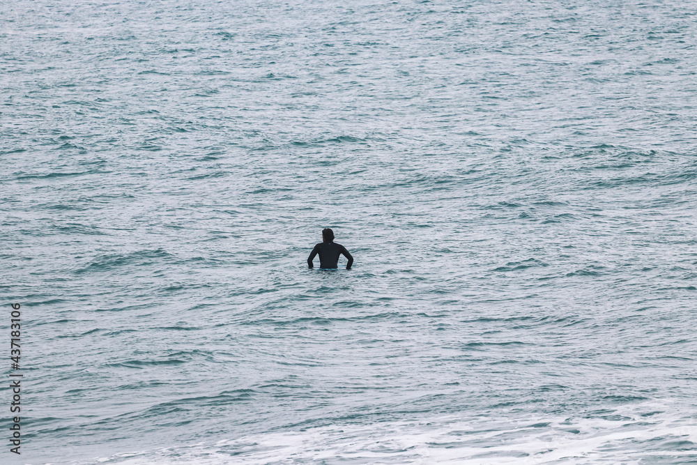 Fototapeta premium Surfer on waiting for a wave in a Surf spot . Surf spot in Ericeira Portugal.