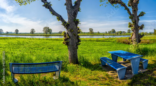 A table and bench for resting and enjoying the river landscape in Maasbommel