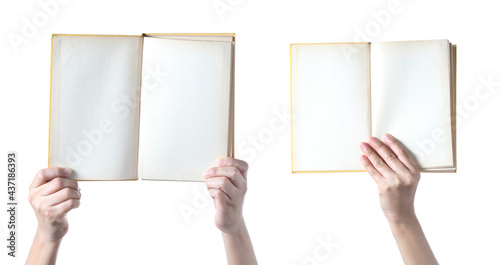 Hand holding pastel book on white background