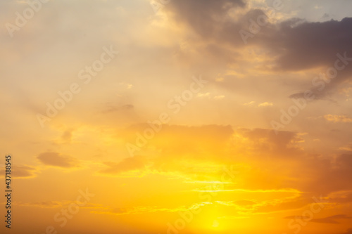Golden sky with clouds at sunset © schankz