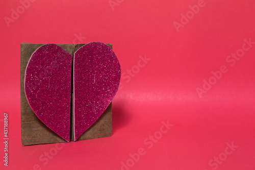 Pink heart on a pink background, copy space.