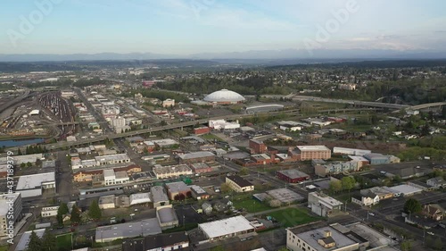 Cinematic 4K orbiting, drone footage of the Tacoma Dome and highway interchange downtown, a city near Seattle in Western Washington, Pacific Northwest, the economic center of Pierce County photo