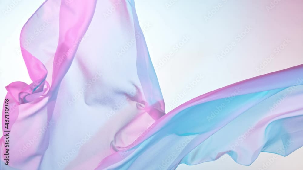 Pastel color transparent silk fabric flowing by wind, super slow motion at 1000 fps.