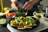 Concept of cooking shrimp salad on wooden table
