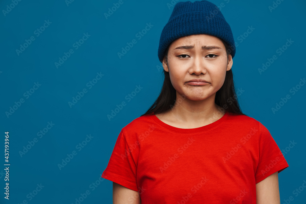 Happy young asian woman in casual clothes standing